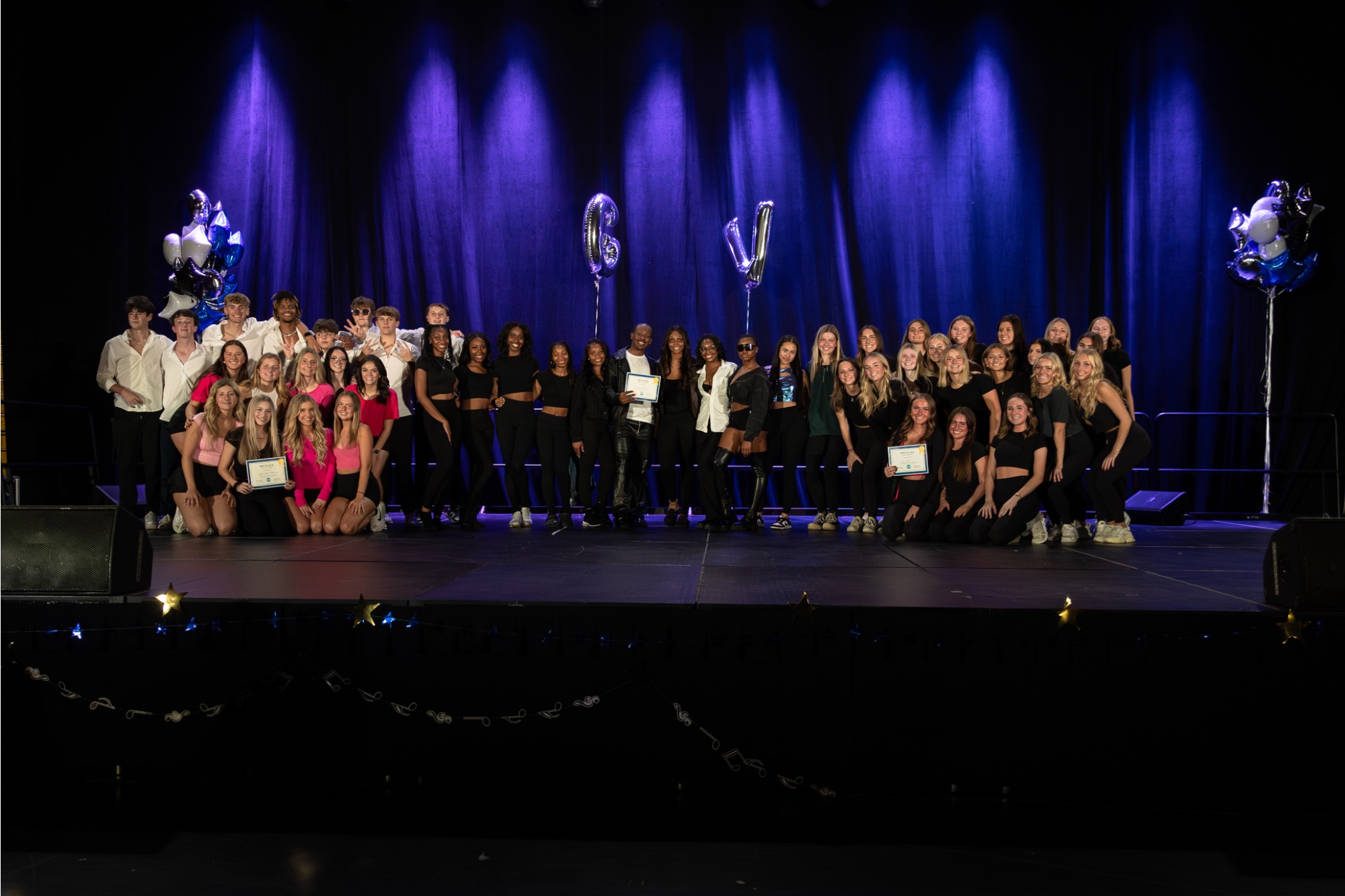 all groups posing together for a photo